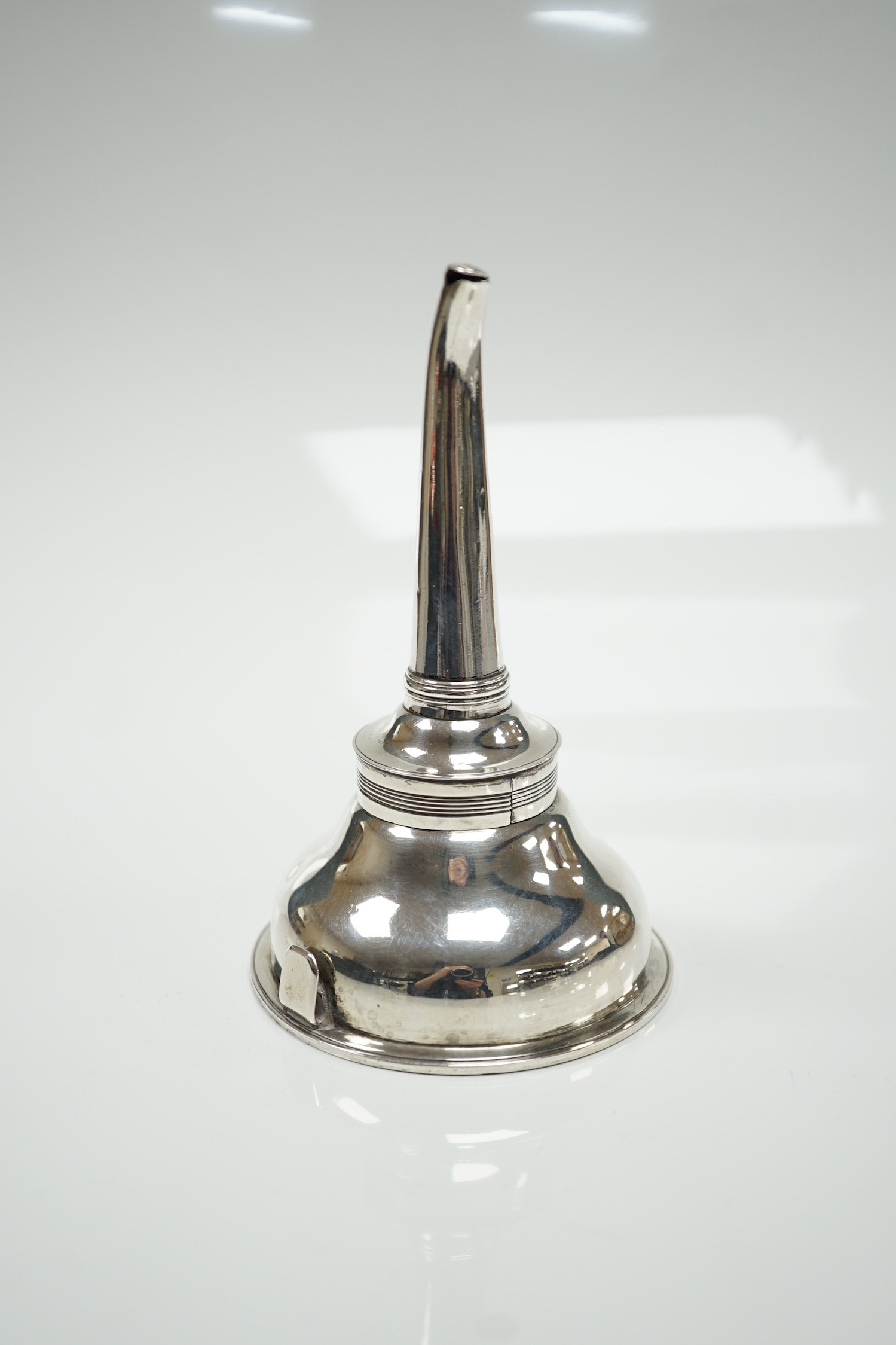 A George III silver wine funnel, Hannah Northcoat?, London, 1799, with muslin ring, 13.7cm, 96 grams.